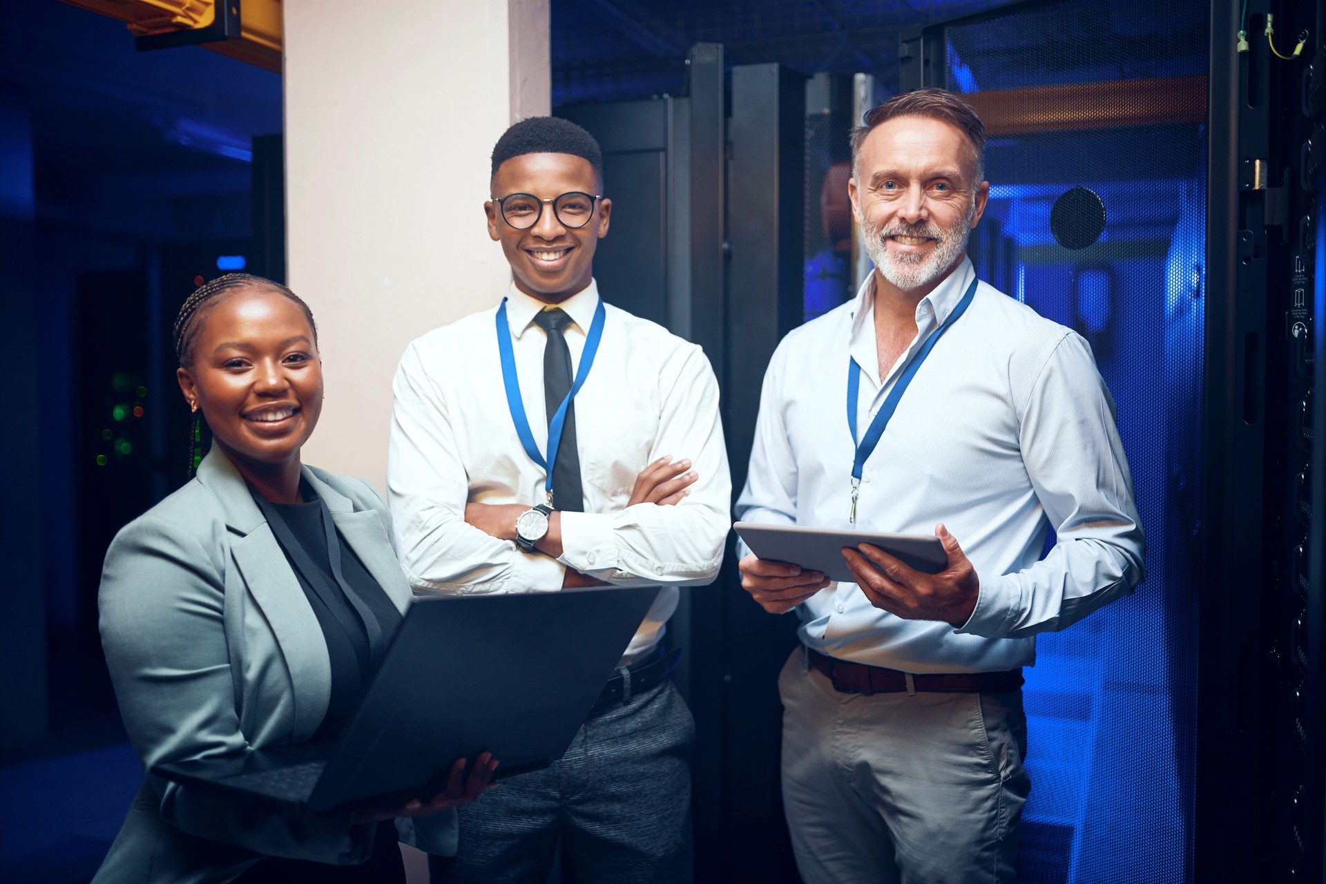 Portrait of a group of technicians working together in a server room